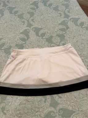Grand Slam White Tennis Skirt with Black Hem
